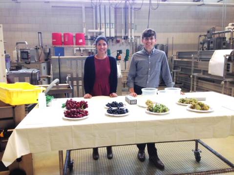 Figure 2: Graduate students, Maria and Drew, get ready to teach attendees about wine grape properties. Maria and Drew are members of Dr. Michela Centinari's research lab. Photo by: Tom Dimick